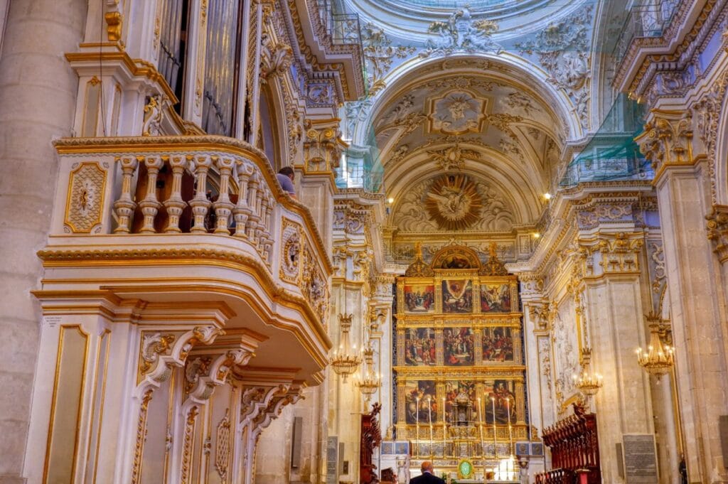 Interior of San Giorgio Cathedral in Modica, showing the decorations, frescoes and columns